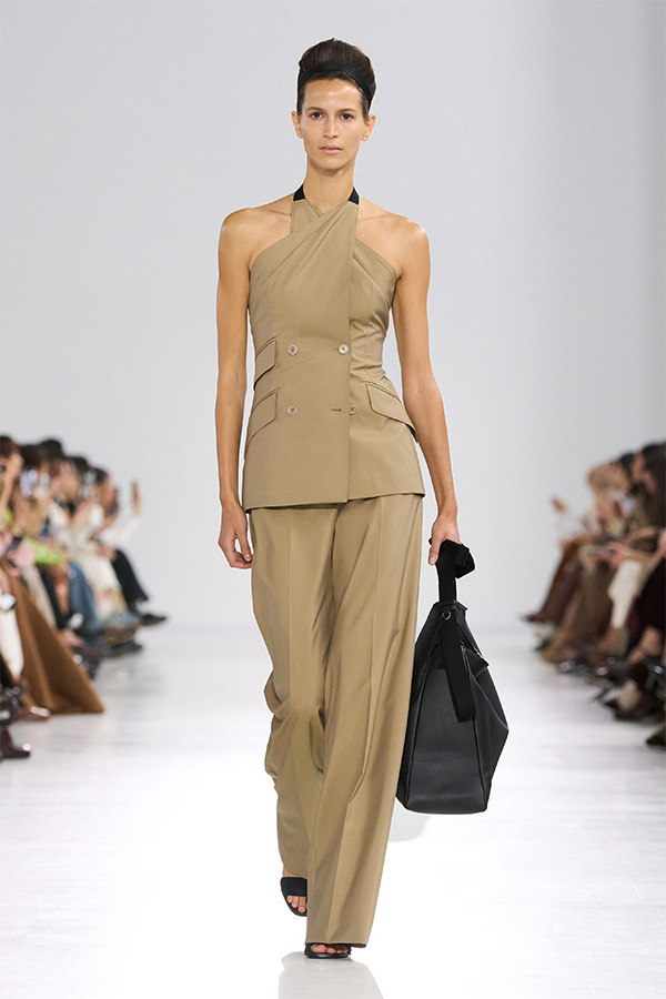 Max Mara Spring/Summer 2026 Fashion Show - Look with Sleeveless Blazer and matching Trousers with black bag.